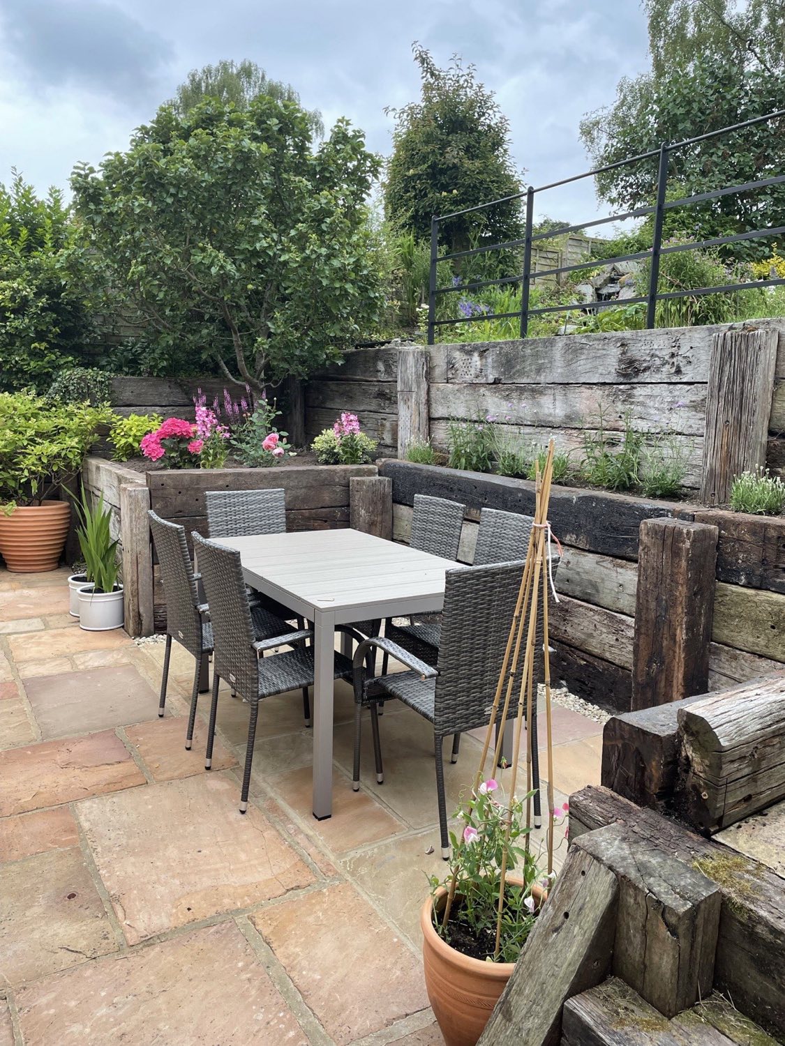 Sleeper walls, fencing and paving tied together on one project.